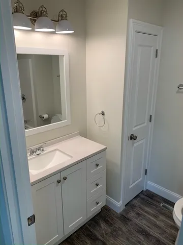 a bathroom with a sink and mirror