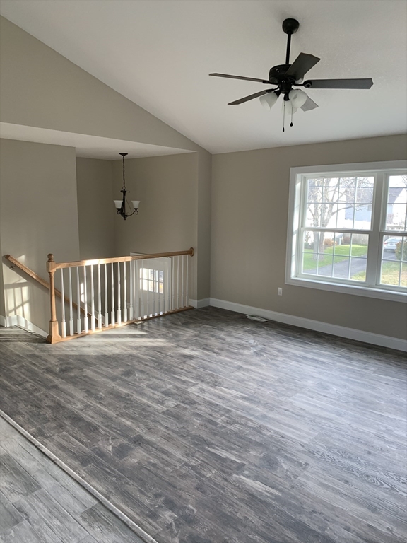 86 Beaumont Avenue Chicopee, MA 01013 - Photo 5 of 8 a view of an empty room with a window and a ceiling fan