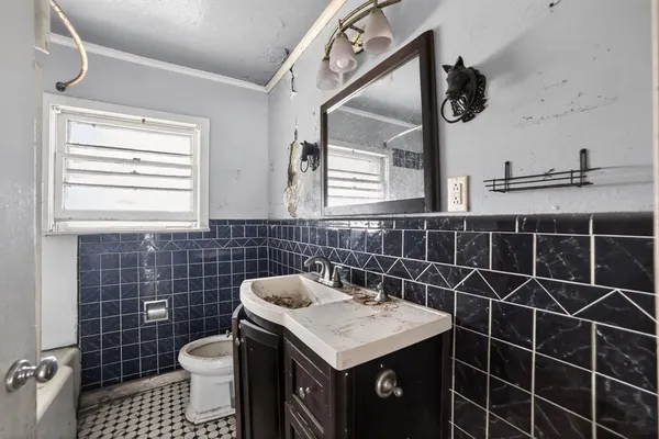 a bathroom with a shower a toilet and a bathtub