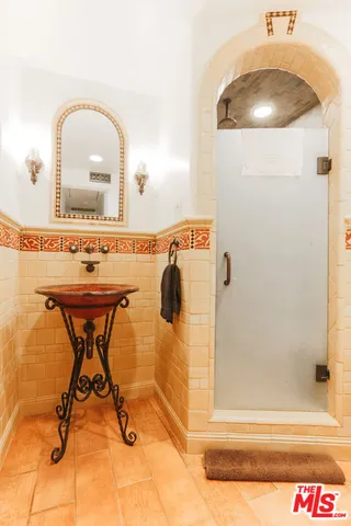 a bathroom with a sink and mirror