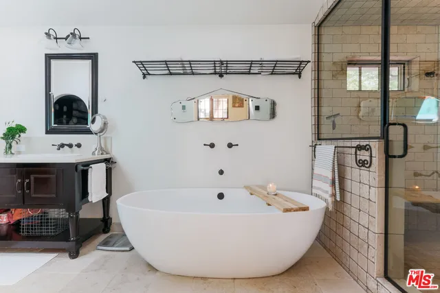 a bathroom with a bathtub and a sink