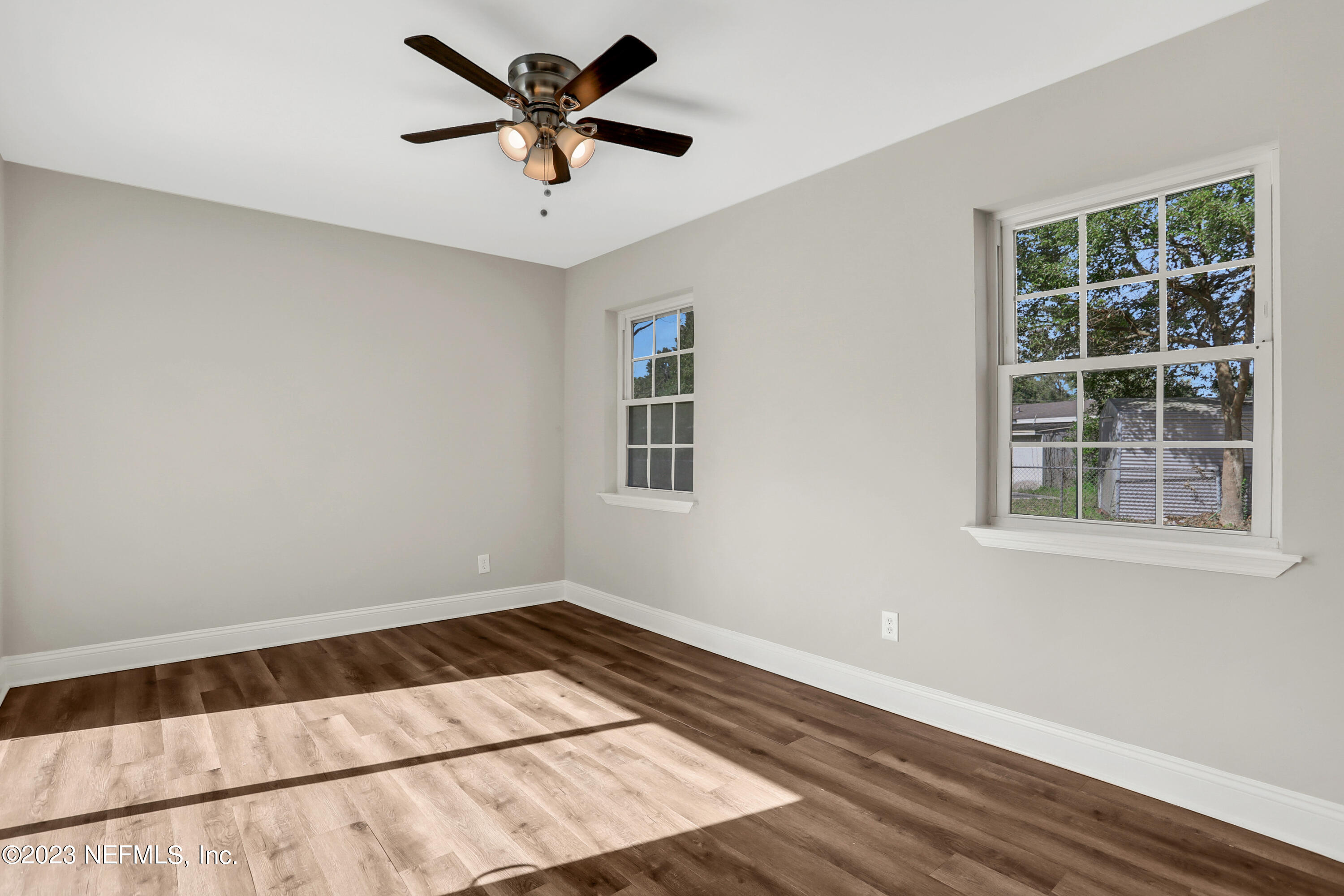 5922 Ridgeway Road East Jacksonville, FL 32244 - Photo 28 of 35 a view of a big room with wooden floor and windows