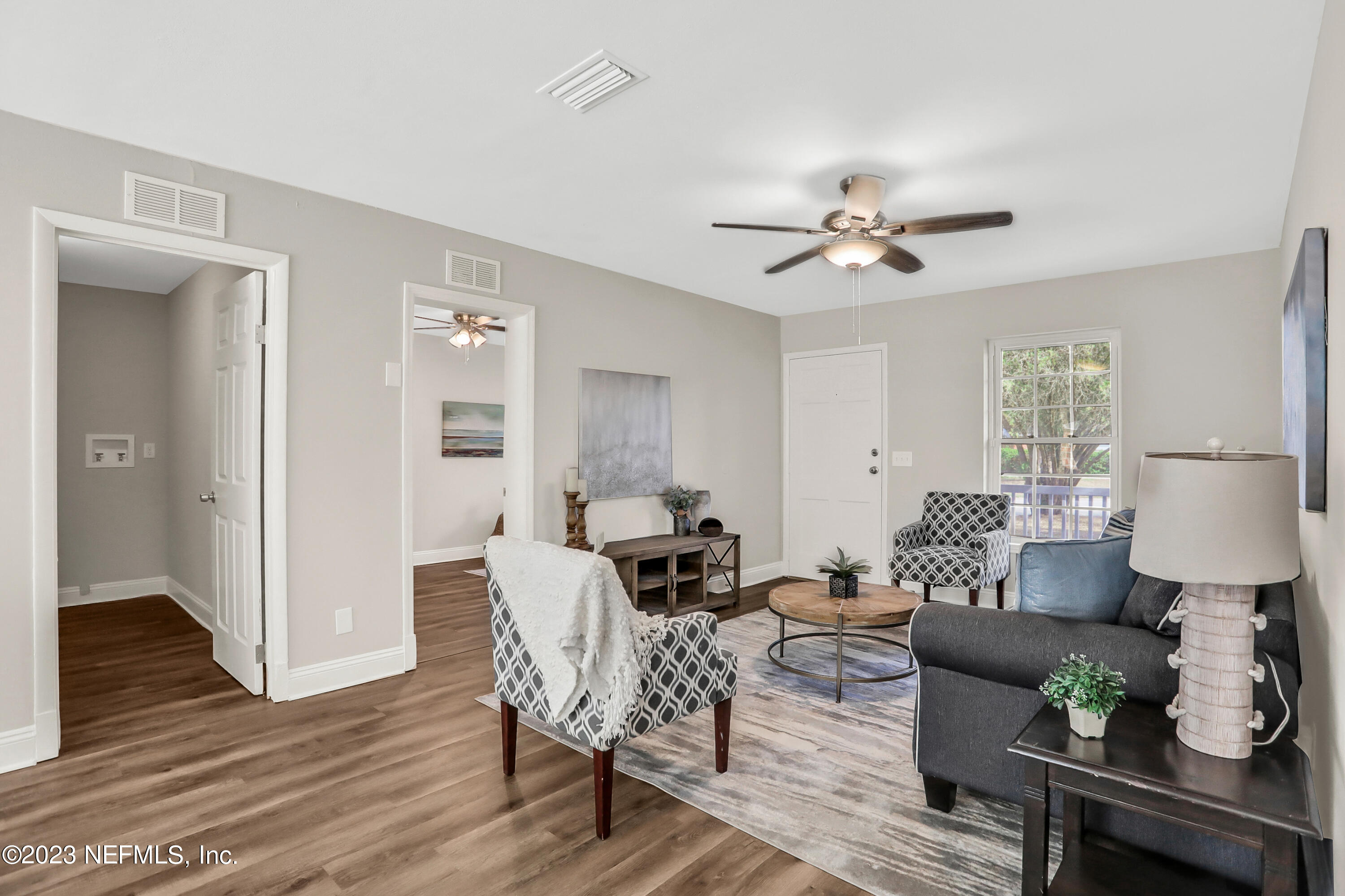 5922 Ridgeway Road East Jacksonville, FL 32244 - Photo 8 of 35 a living room with furniture and wooden floor