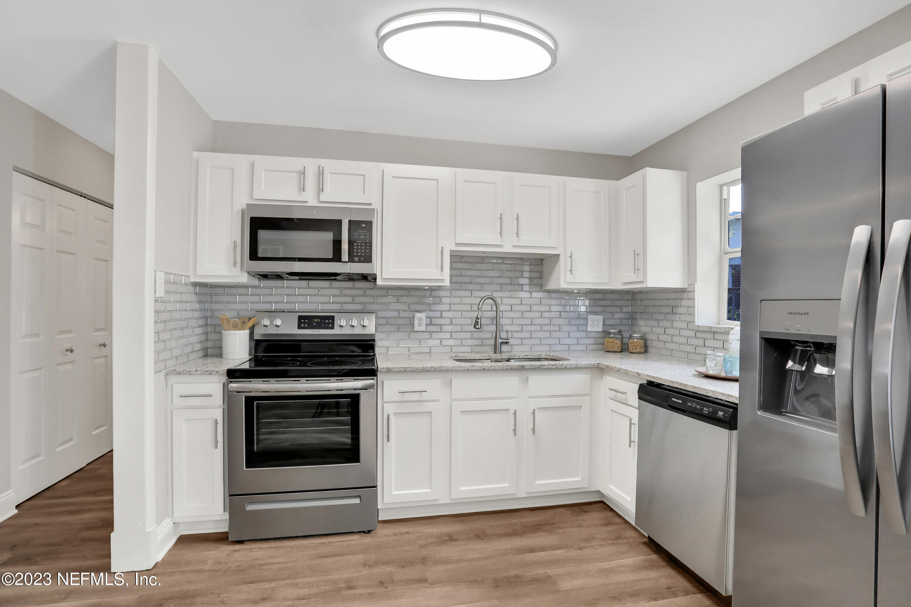 5922 Ridgeway Road East Jacksonville, FL 32244 - Photo 10 of 35 a kitchen with cabinets stainless steel appliances and a counter space