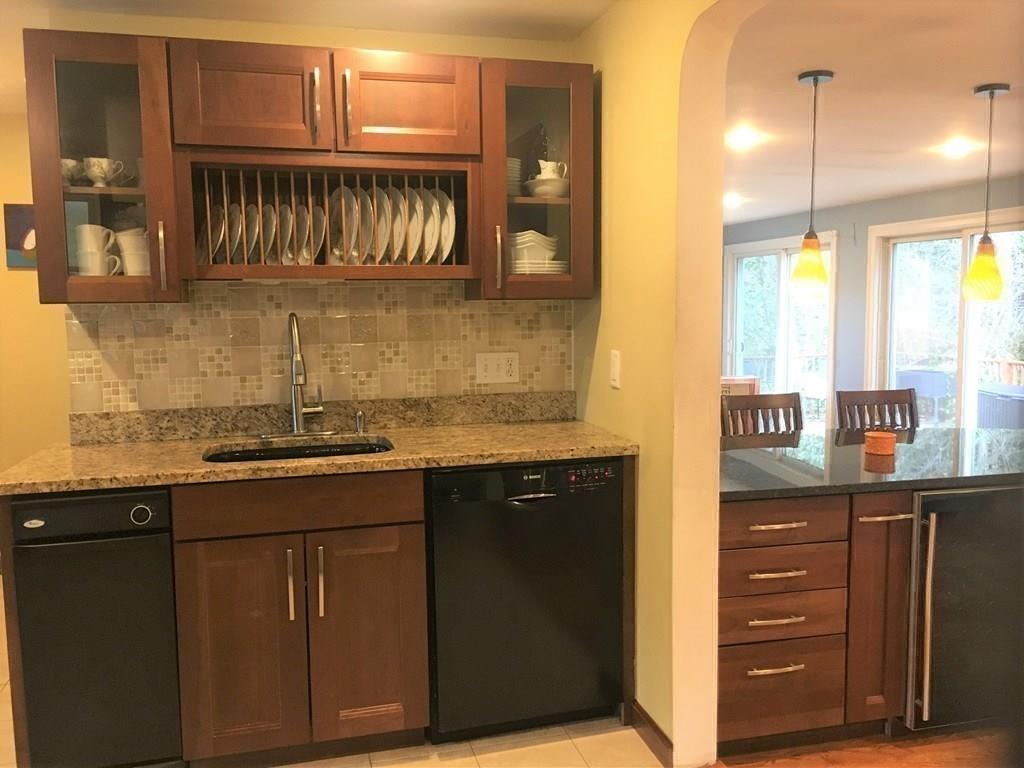 1 Edgar Road Billerica, MA 01821 - Photo 12 of 32 a kitchen with a sink and cabinets