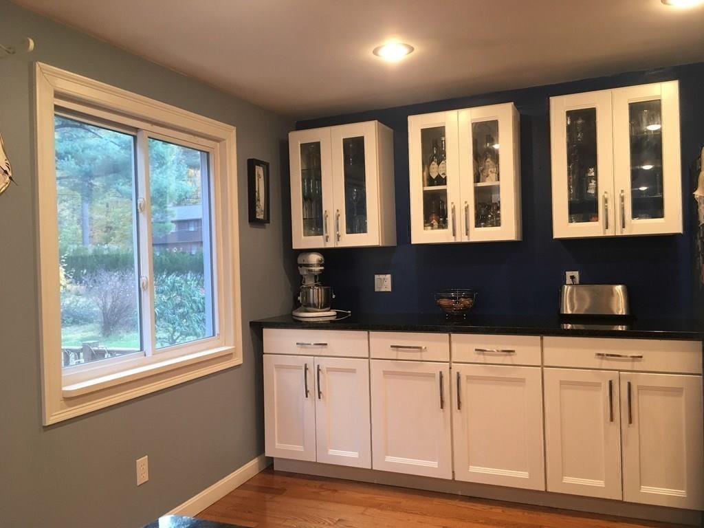 1 Edgar Road Billerica, MA 01821 - Photo 13 of 32 a kitchen with white cabinets a sink and a window