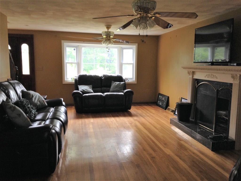 1 Edgar Road Billerica, MA 01821 - Photo 18 of 32 a living room with furniture and a fireplace
