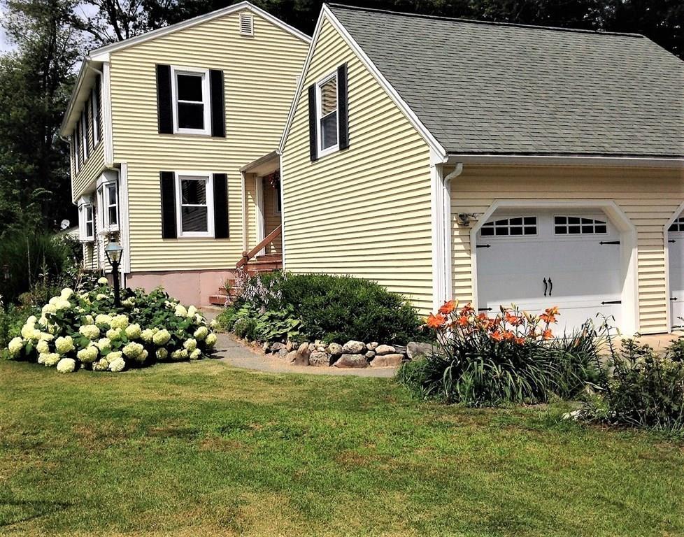 1 Edgar Road Billerica, MA 01821 - Photo 2 of 32 a front view of a house with a yard