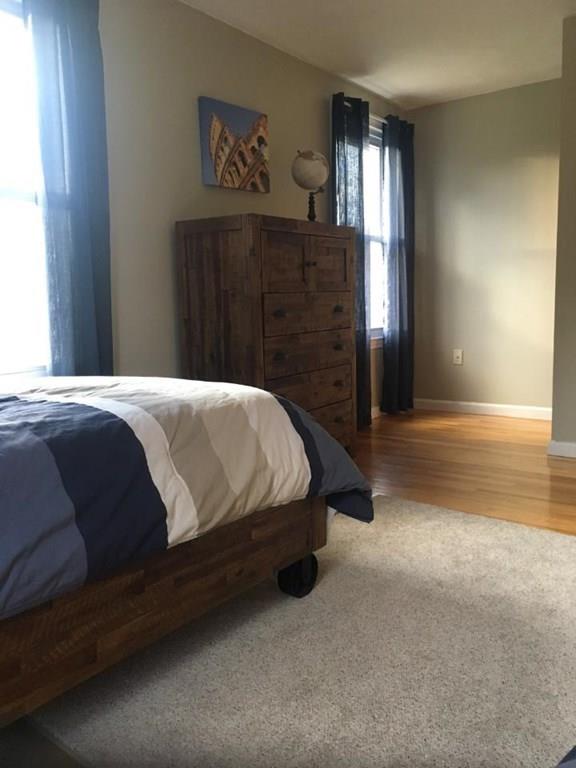 1 Edgar Road Billerica, MA 01821 - Photo 27 of 32 a bedroom with a bed and cabinets