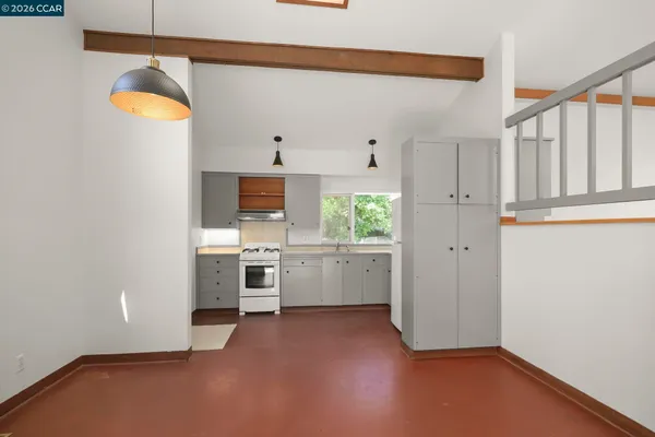 a view of a kitchen with furniture and window