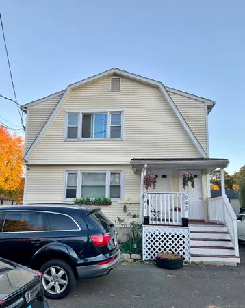 a car parked in front of a house