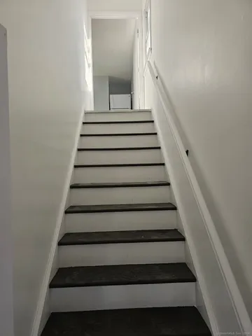 a kitchen with stainless steel appliances a stove a microwave and cabinets