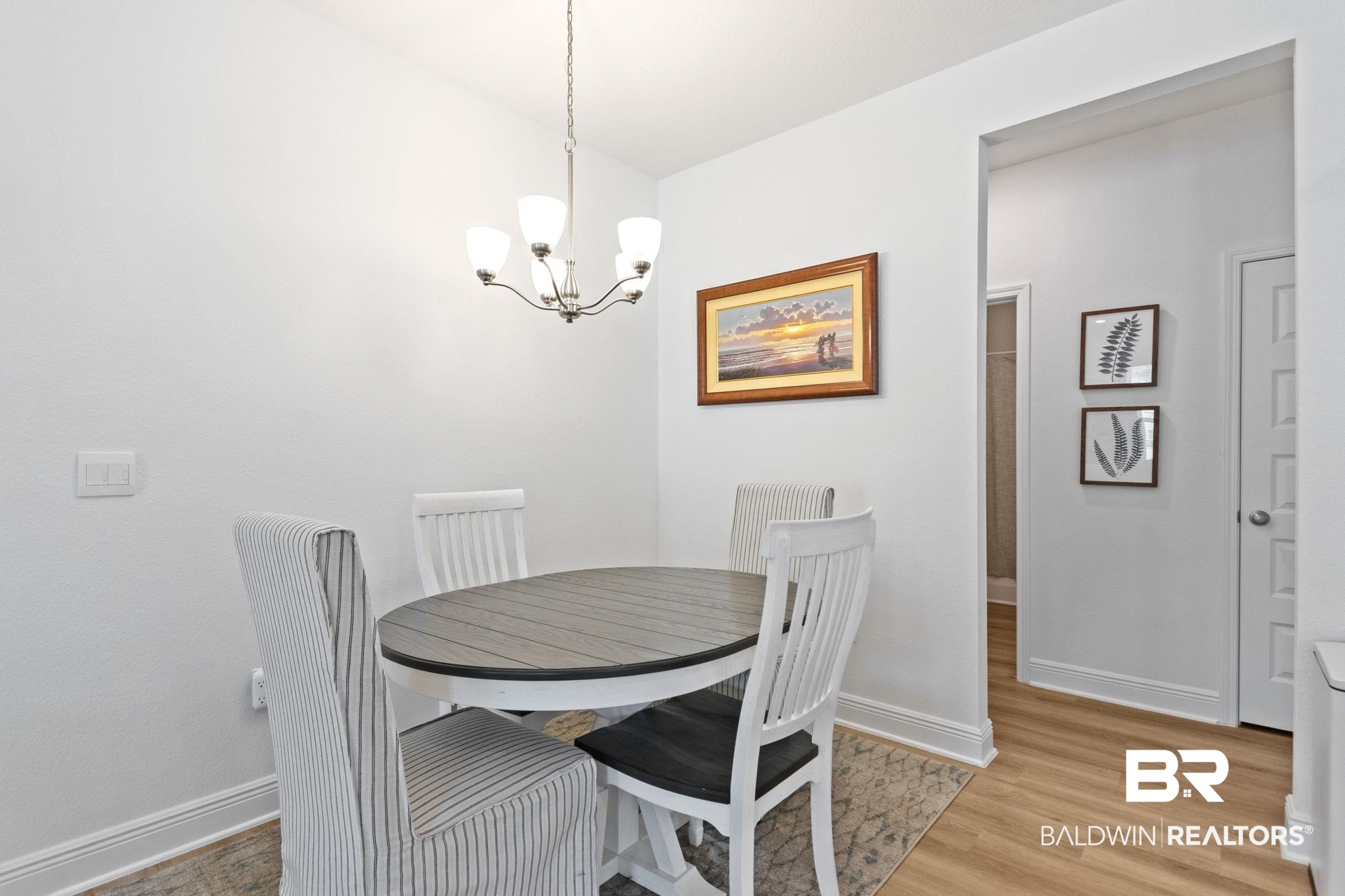 12919 Torrent Road Fairhope, AL 36532 - Photo 27 of 74 Dining room with light wood-style floors and suspended lighting