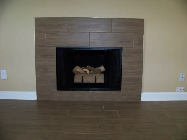 a fireplace with a wooden floor