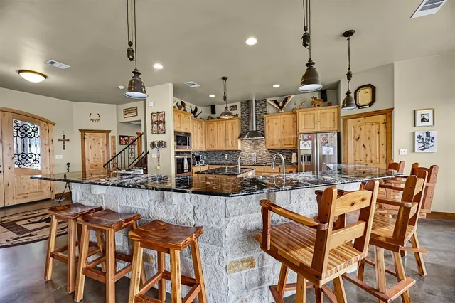 a dining room with furniture water view and a window