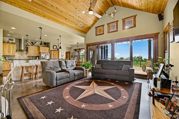 a view of dining room with wooden floor and furniture