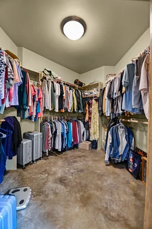 a spacious bathroom with a mirror and a sink