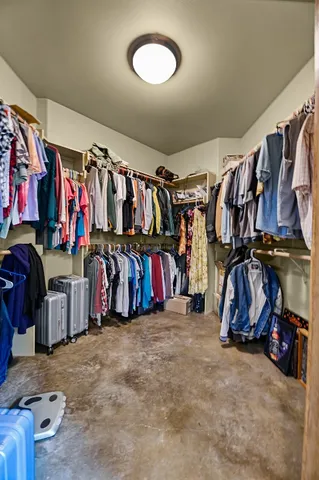 a spacious bathroom with a mirror and a sink
