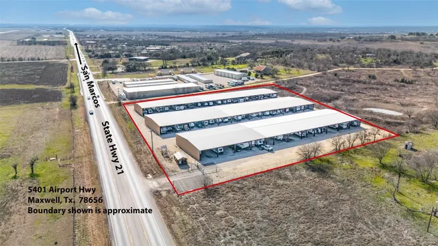 a view of a town with mountains in the background