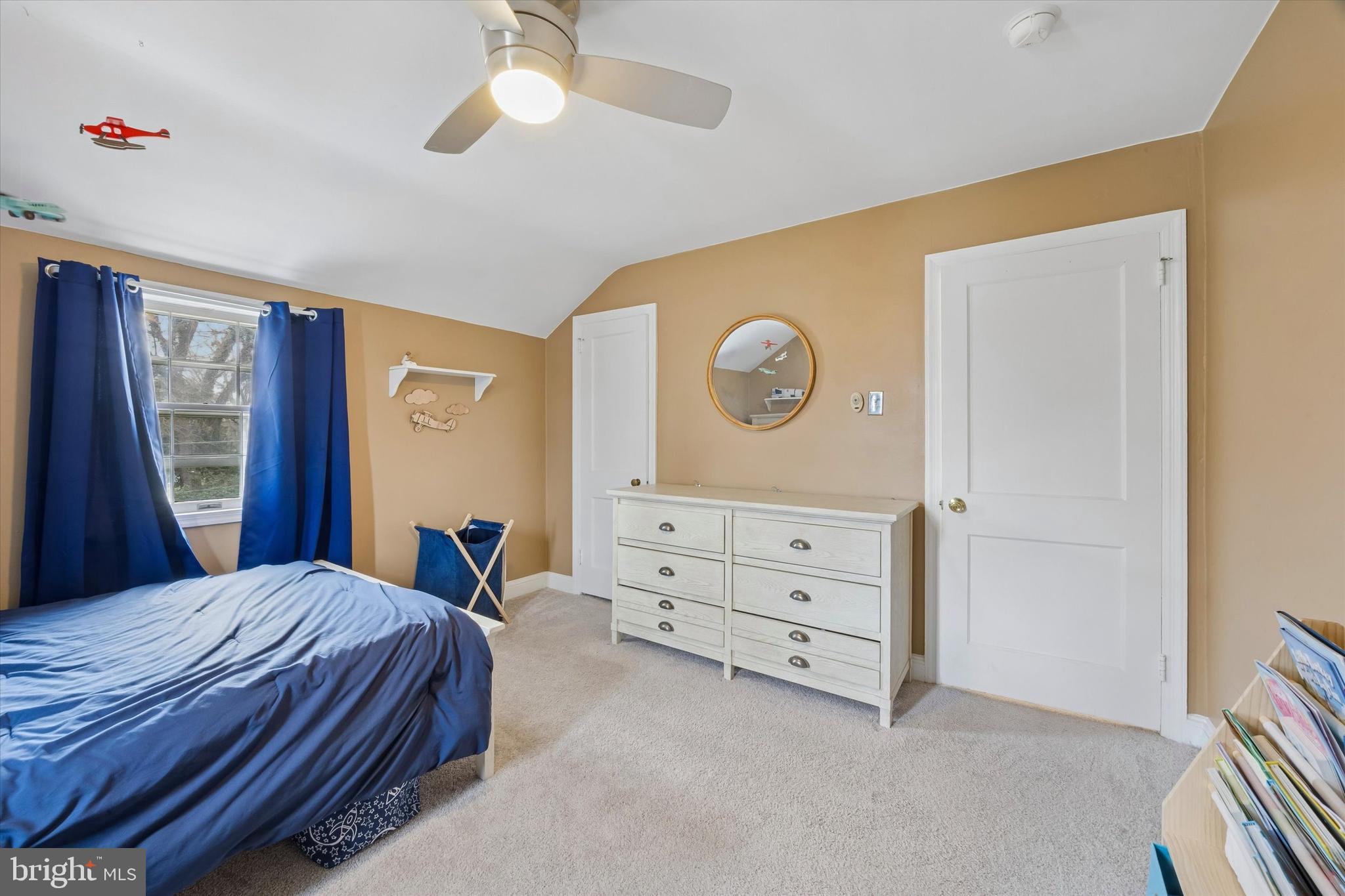 354 East Springfield Road Springfield, PA 19064 - Photo 17 of 22 a bedroom with a bed and a chandelier