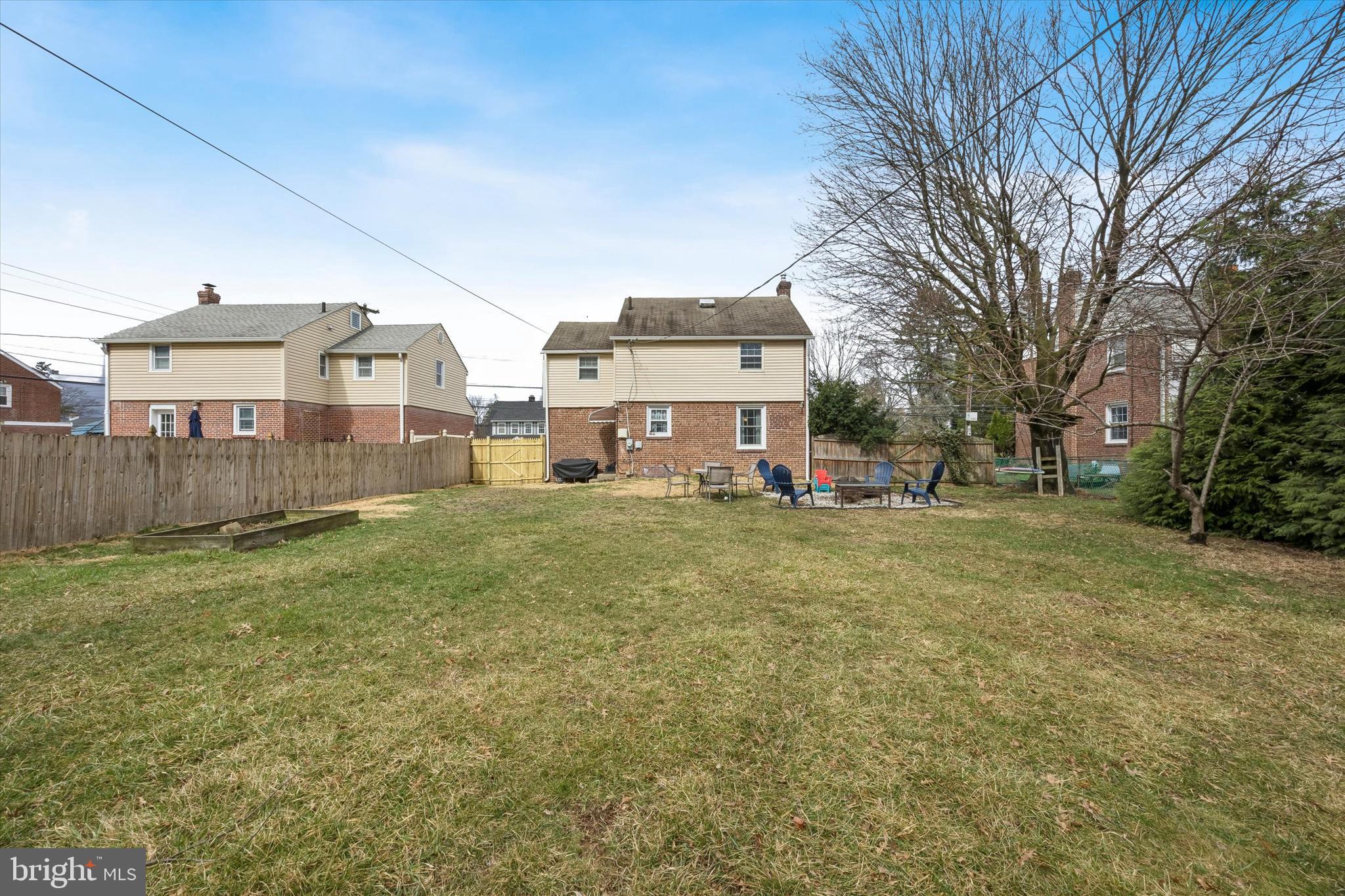 354 East Springfield Road Springfield, PA 19064 - Photo 22 of 22 a view of a big house with a big yard and large trees