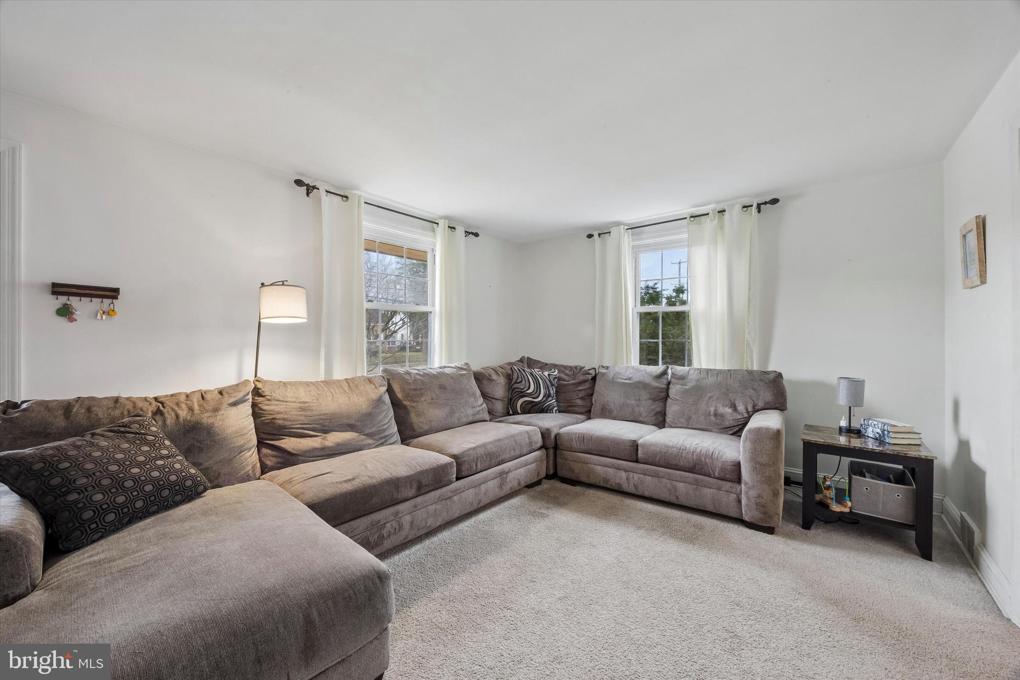 354 East Springfield Road Springfield, PA 19064 - Photo 4 of 22 a living room with furniture and a couch