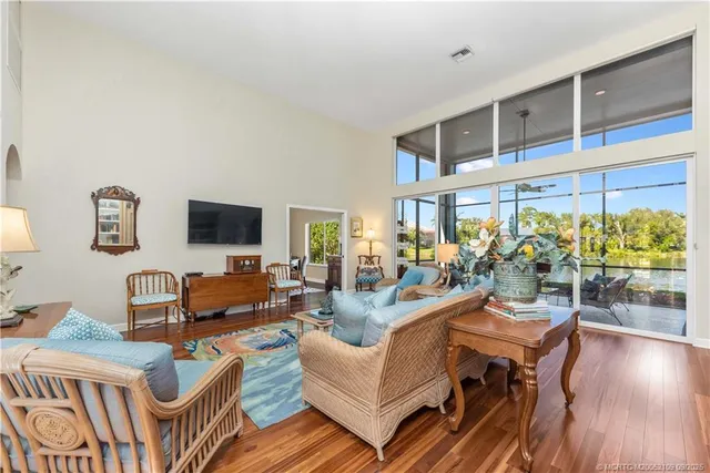 a living room with furniture fireplace and a table