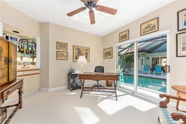 a bathroom with a sink mirror and toilet