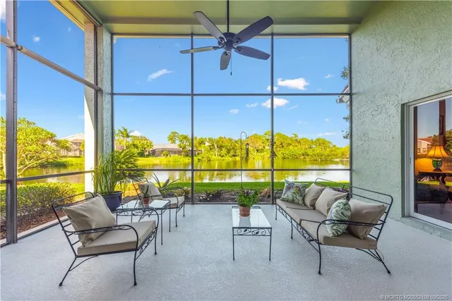 a swimming pool with outdoor seating and outdoor seating