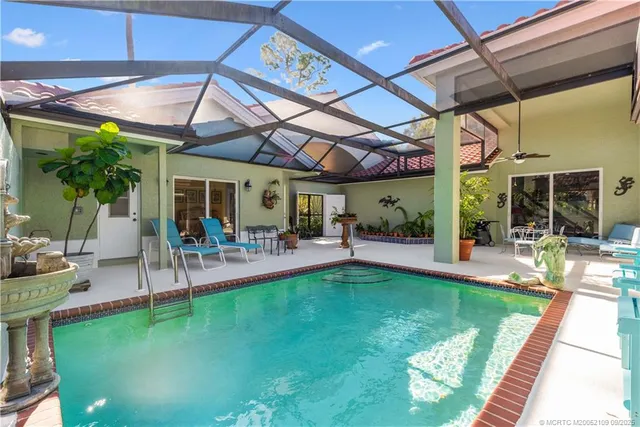 a view of a backyard with a patio and a garden