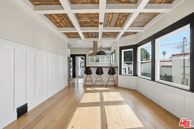 a view of a large room with wooden floor and iron