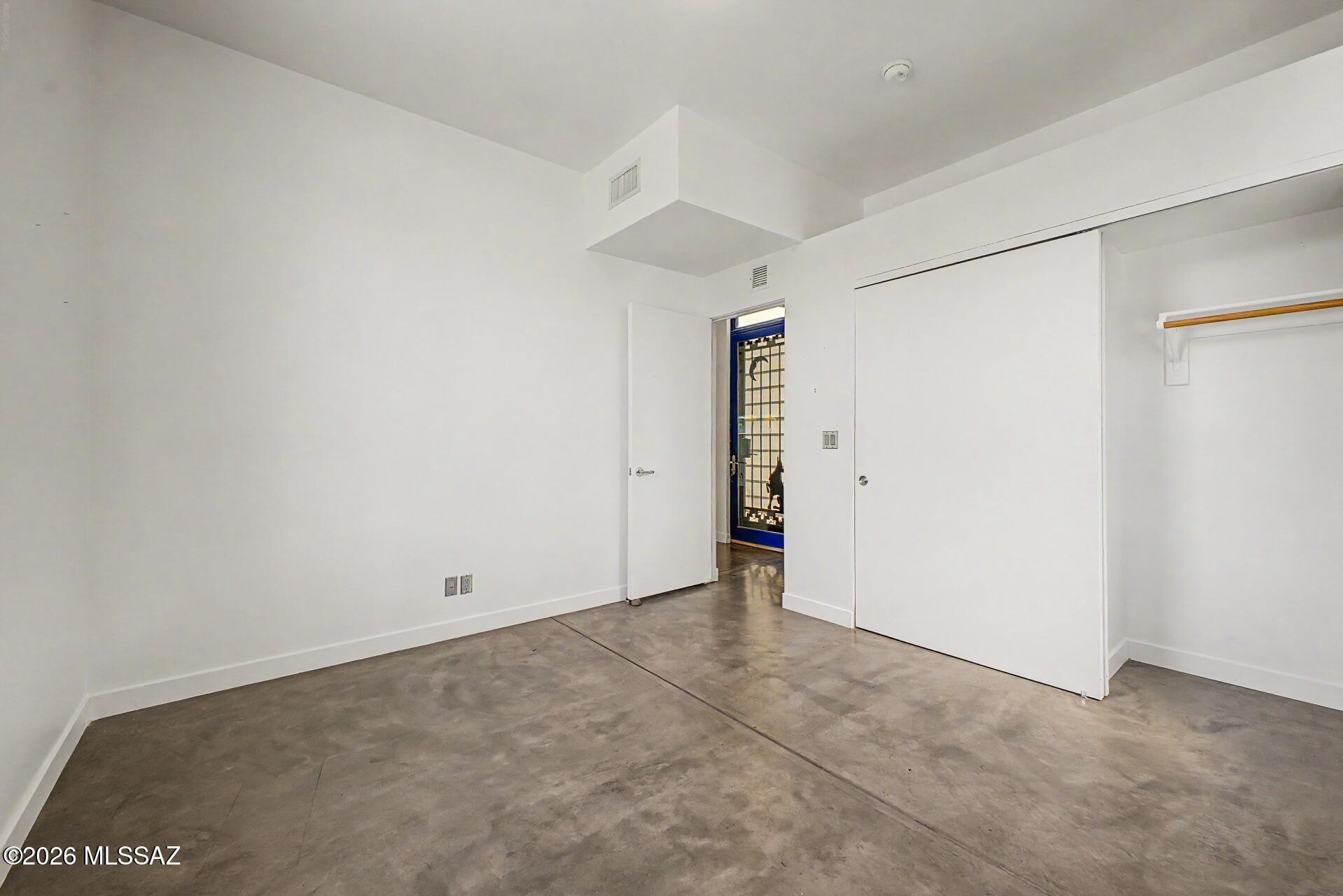 3605 East 3rd Street Tucson, AZ 85716 - Photo 14 of 39 The first floor features a bedroom with private access to a full bathroom.