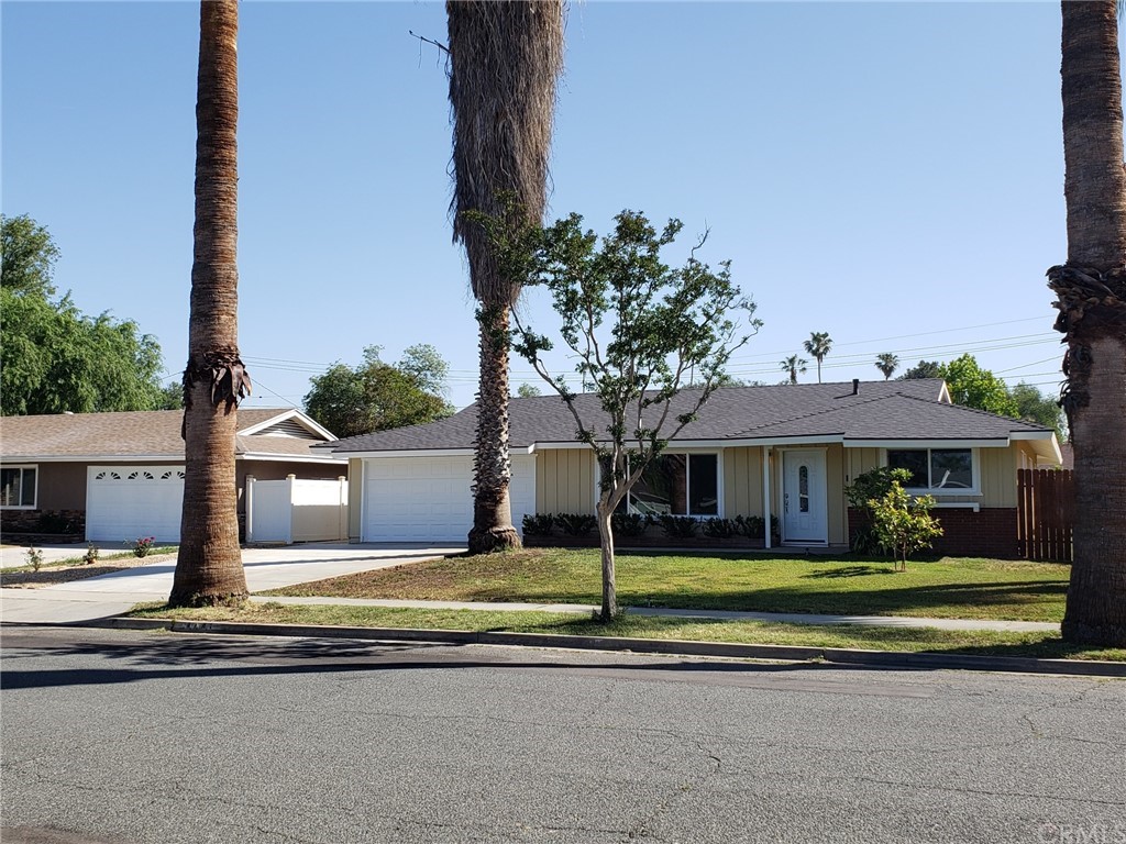 4441 Elora Court Riverside, CA 92503 - Photo 1 of 1 a front view of a house with a garden and plants