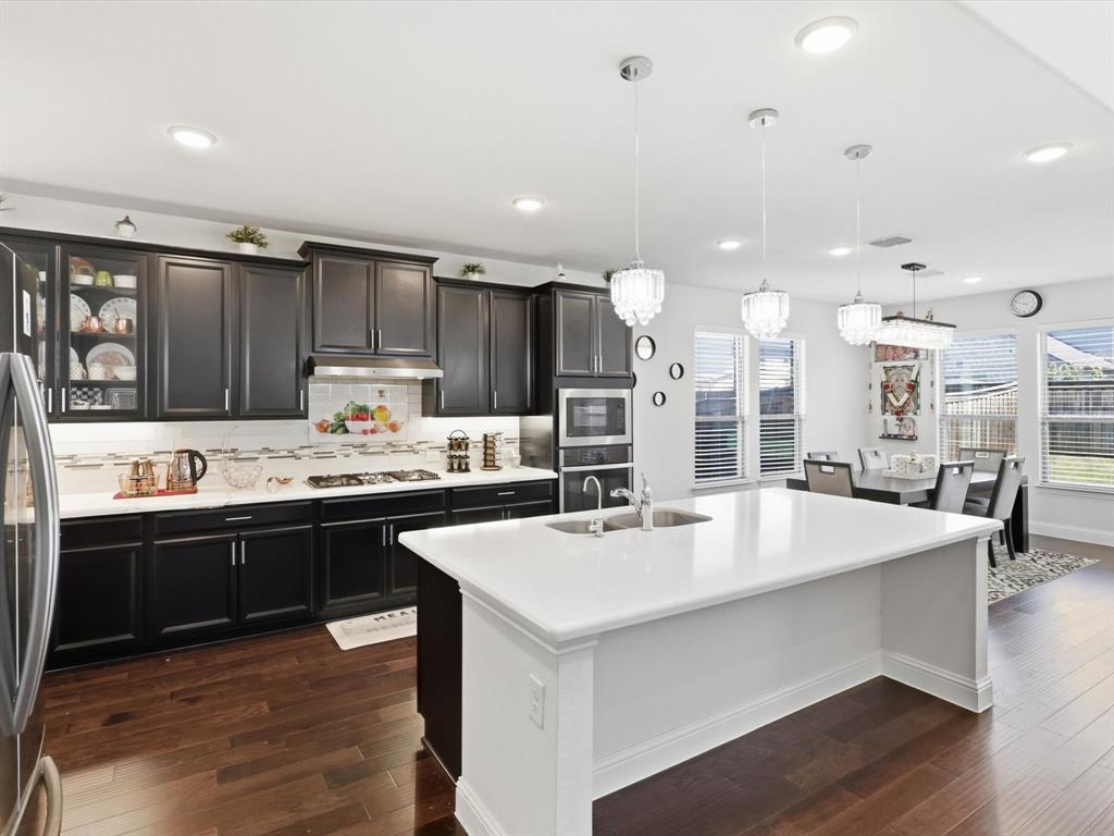 16458 Ryder Rock Road Frisco, TX 75033 - Photo 4 of 25 Large Kitchen with Quartz Counter tops