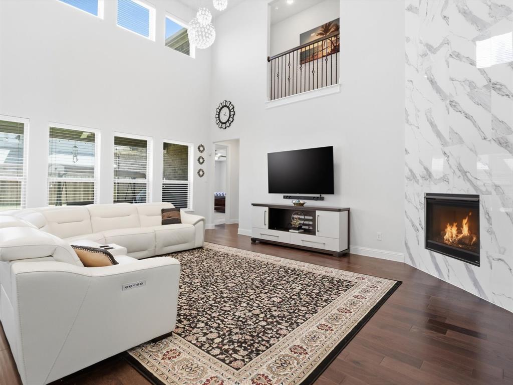 16458 Ryder Rock Road Frisco, TX 75033 - Photo 7 of 25 Living Room with Floor to Ceiling Fireplace Tile