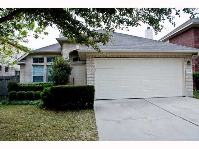 3605 Bratton Ridge Crossing Austin, TX 78728 - Photo 1 of 1 a front view of a house with a garden