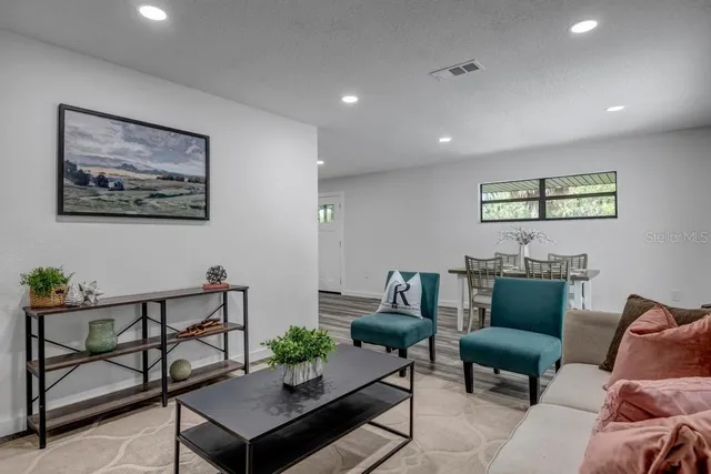 a view of a dining room with furniture window and outside view