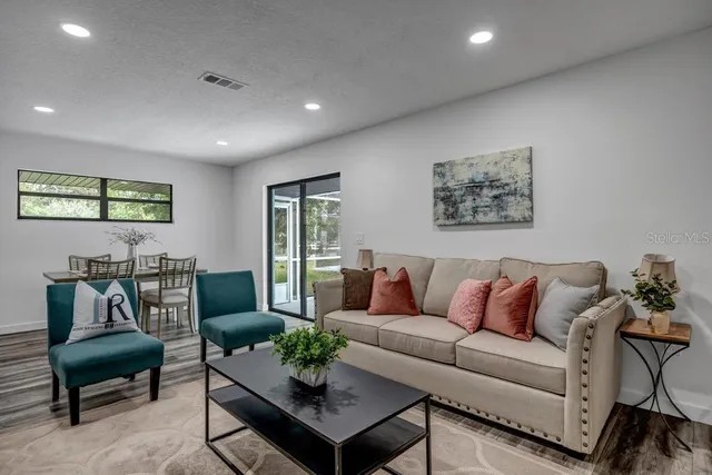 a view of a dining room with furniture window and outside view