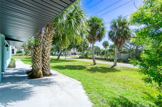 an aerial view of house with yard