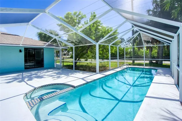 a living room with furniture and a painting