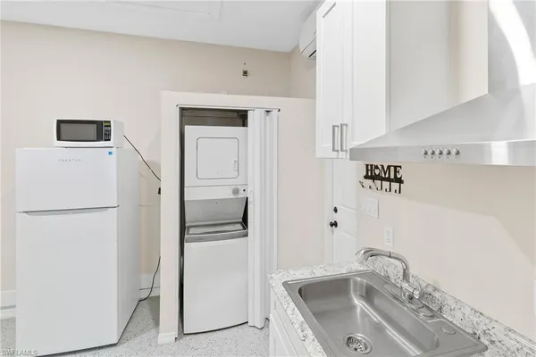 a bathroom with a sink a mirror and shower