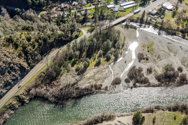 a view of a forest with a yard