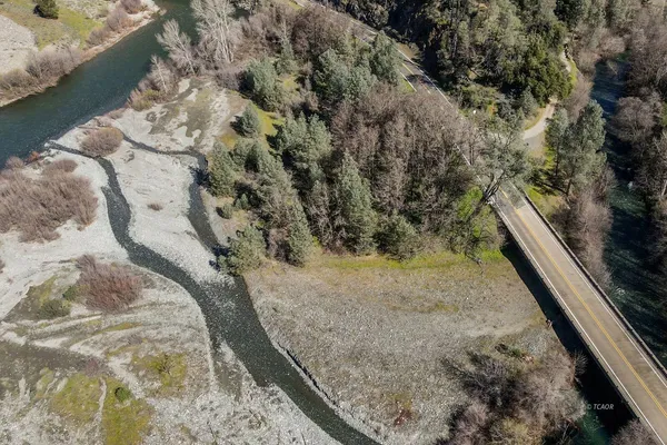 a view of a lake with a forest