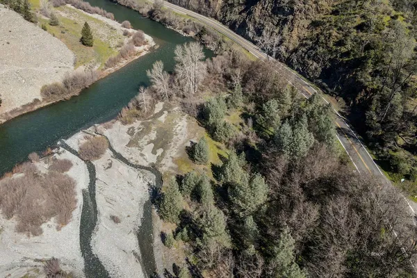 a view of a lush green landscape from a balcony