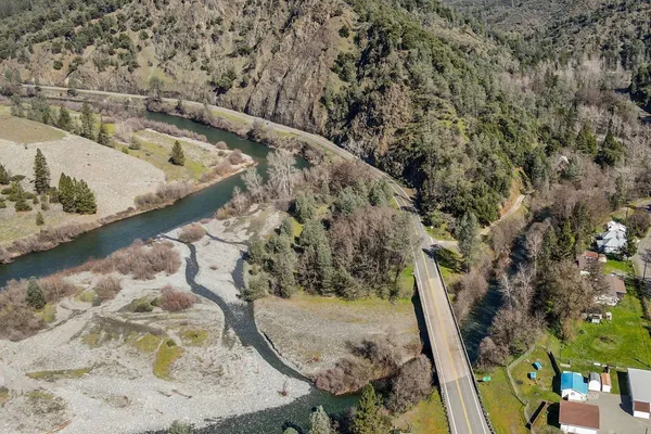 a view of water heater room with wooden floor