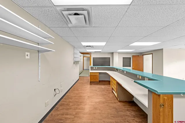 a hallway with seating area and car parked