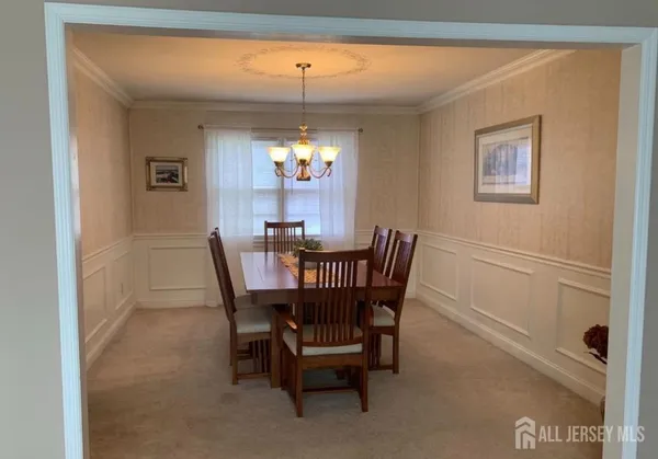 a dining room with furniture and window