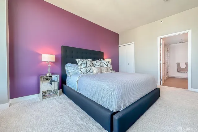 a bathroom with double vanity sinks and a mirror
