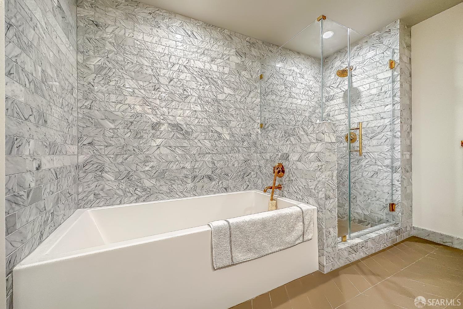 401 Harrison Street, Unit 44A San Francisco, CA 94105 - Photo 30 of 42 a bathroom with a bathtub and shower