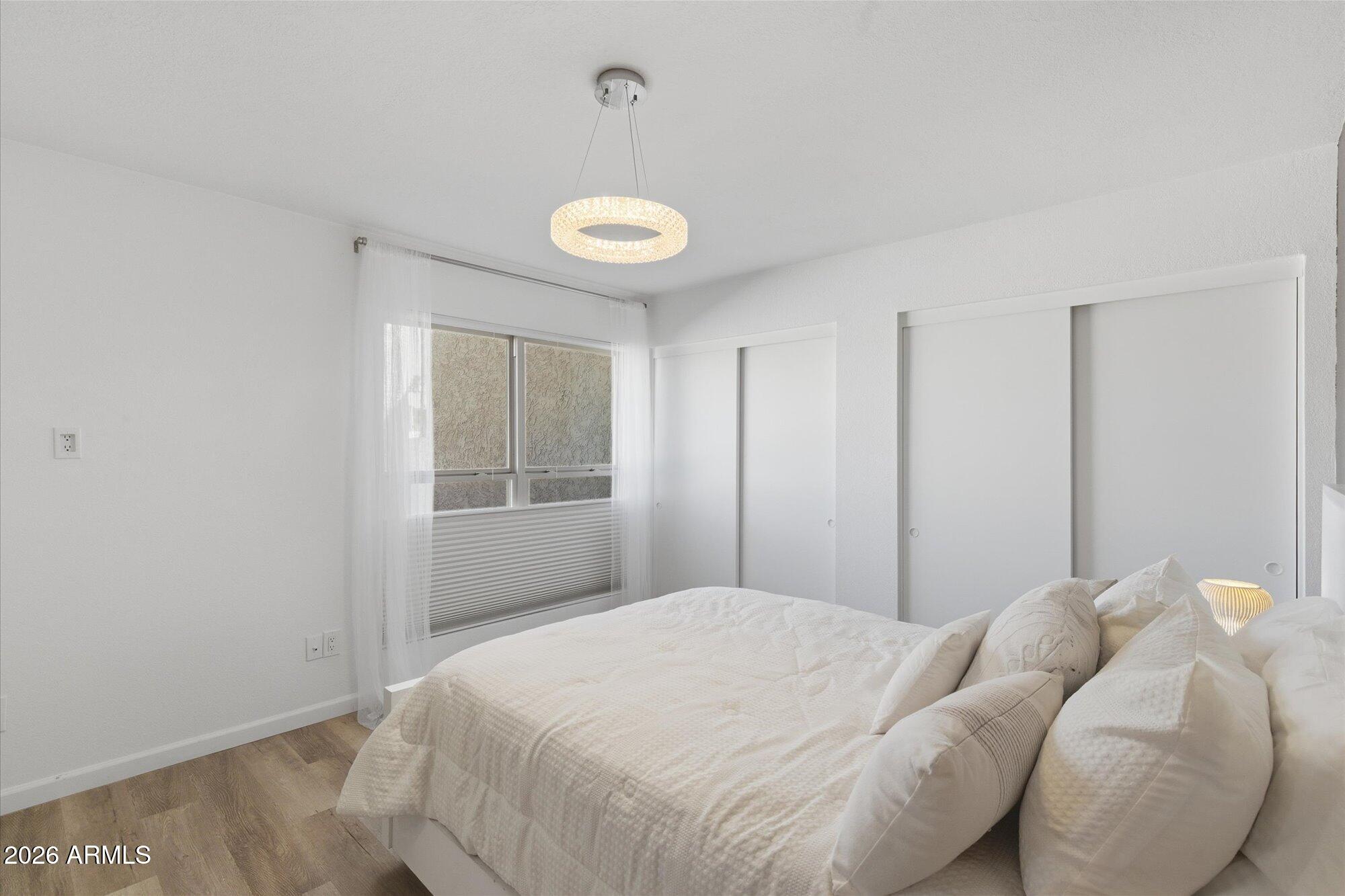 4019 East Charter Oak Road Phoenix, AZ 85032 - Photo 12 of 23 a bedroom with a bed and a window